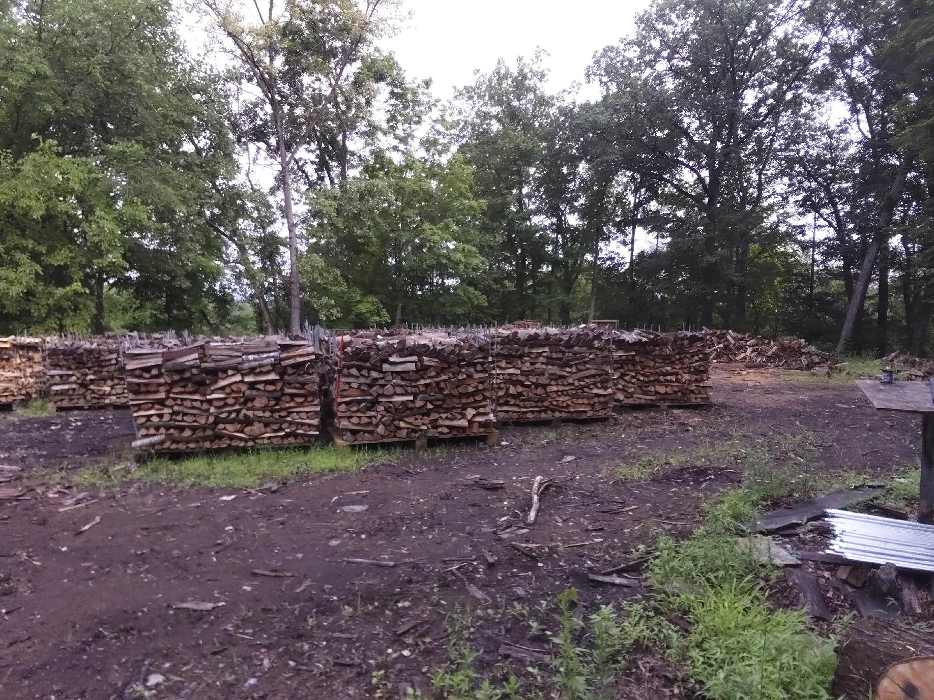 Seasoned Dried Mixed Hardwood - Neatly stacked firewood ready for delivery